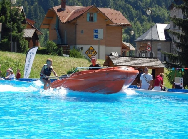  child water skiing in swimming pool 